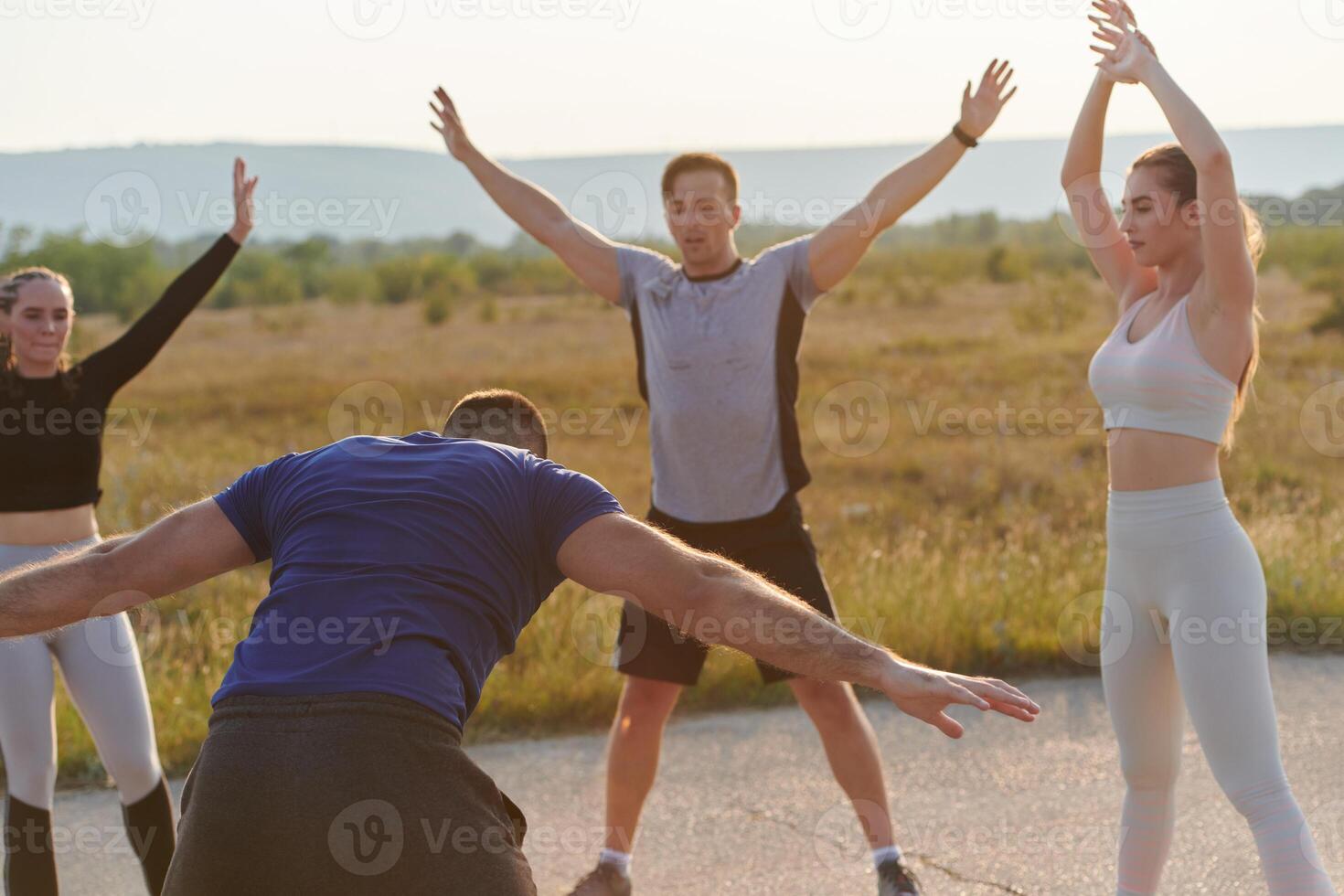 Diverse Group of Athletes Prepare Together for a Run photo