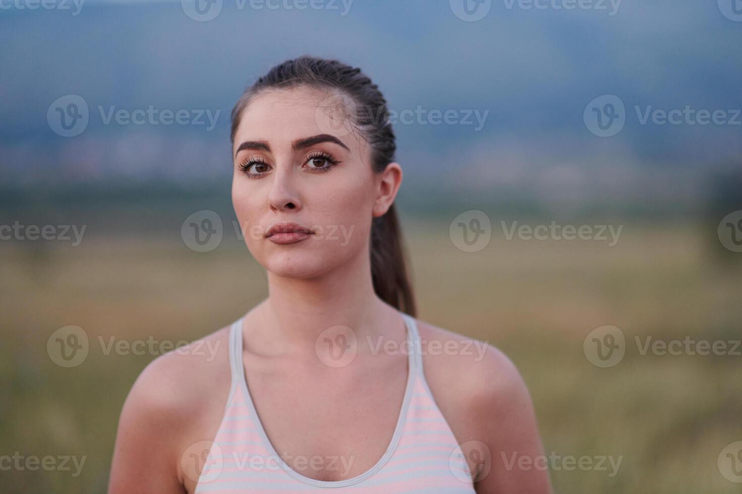 Close-Up Portrait of Determined Athlete Resting After Intense Workout photo