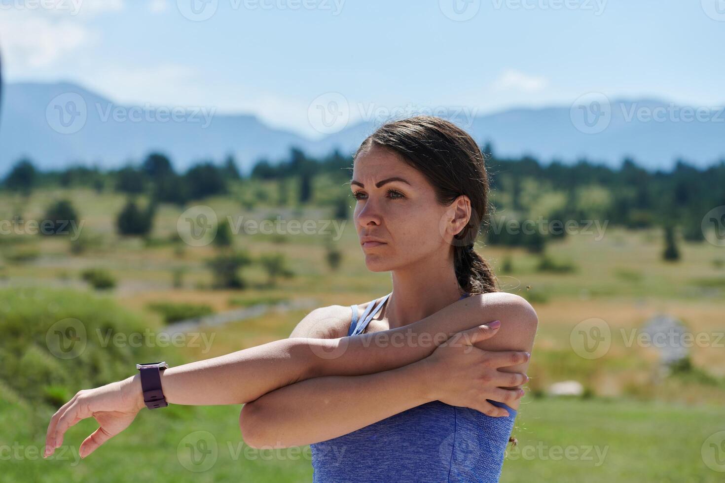 Determined Stretch. Athletic Woman Embraces Post-Run Flexibility in Nature. photo