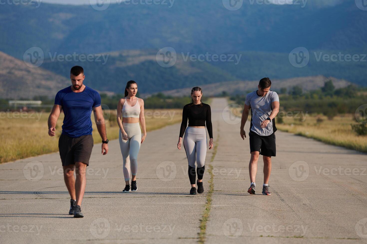 A group of friends maintains a healthy lifestyle by running outdoors on a sunny day, bonding over fitness and enjoying the energizing effects of exercise and nature photo