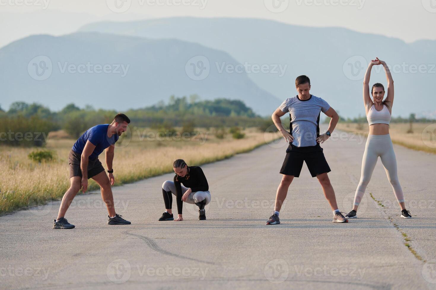 Diverse Group of Athletes Prepare Together for a Run photo