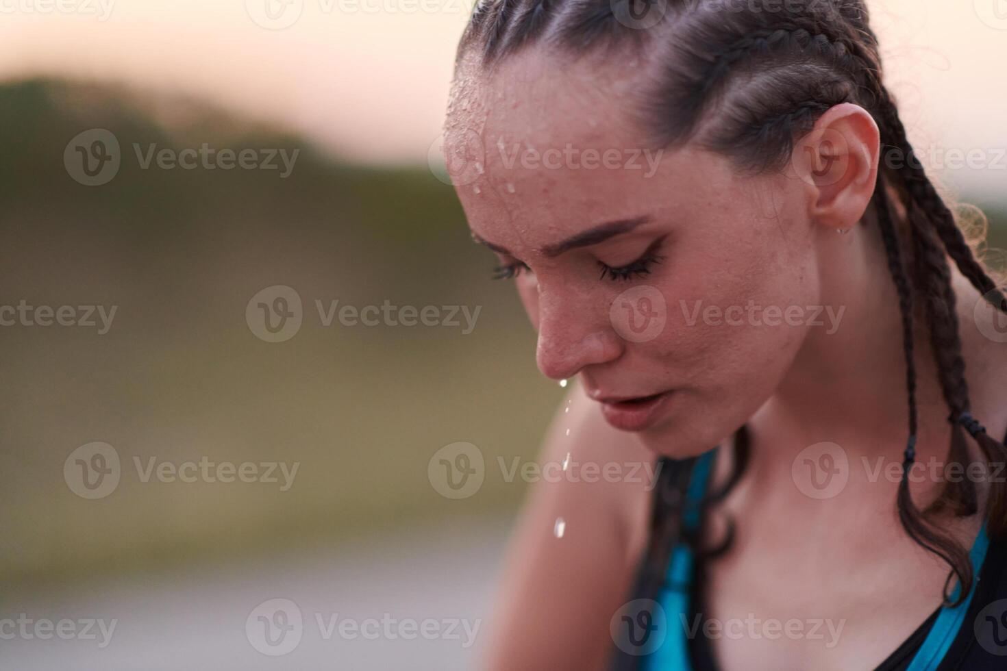 Close-Up Portrait of Determined Athlete Resting After Intense Workout photo