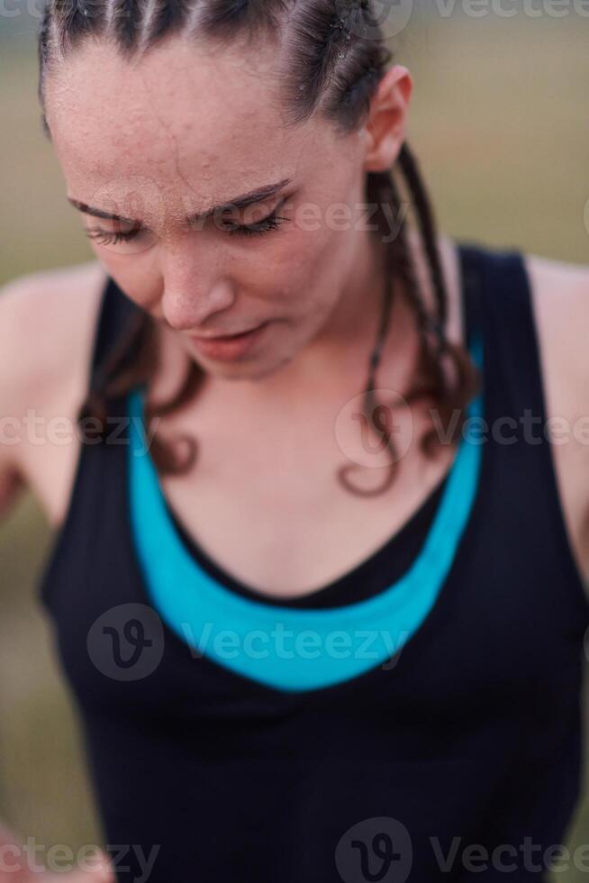 Close-Up Portrait of Determined Athlete Resting After Intense Workout photo