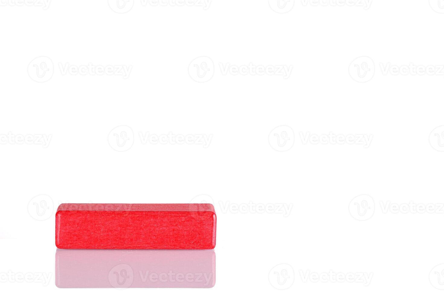 Wooden cube of red color on a white background photo
