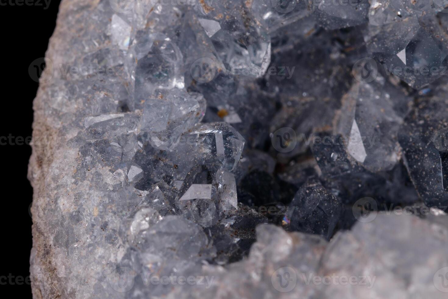 Celestine mineral stone macro on microcline on black background photo
