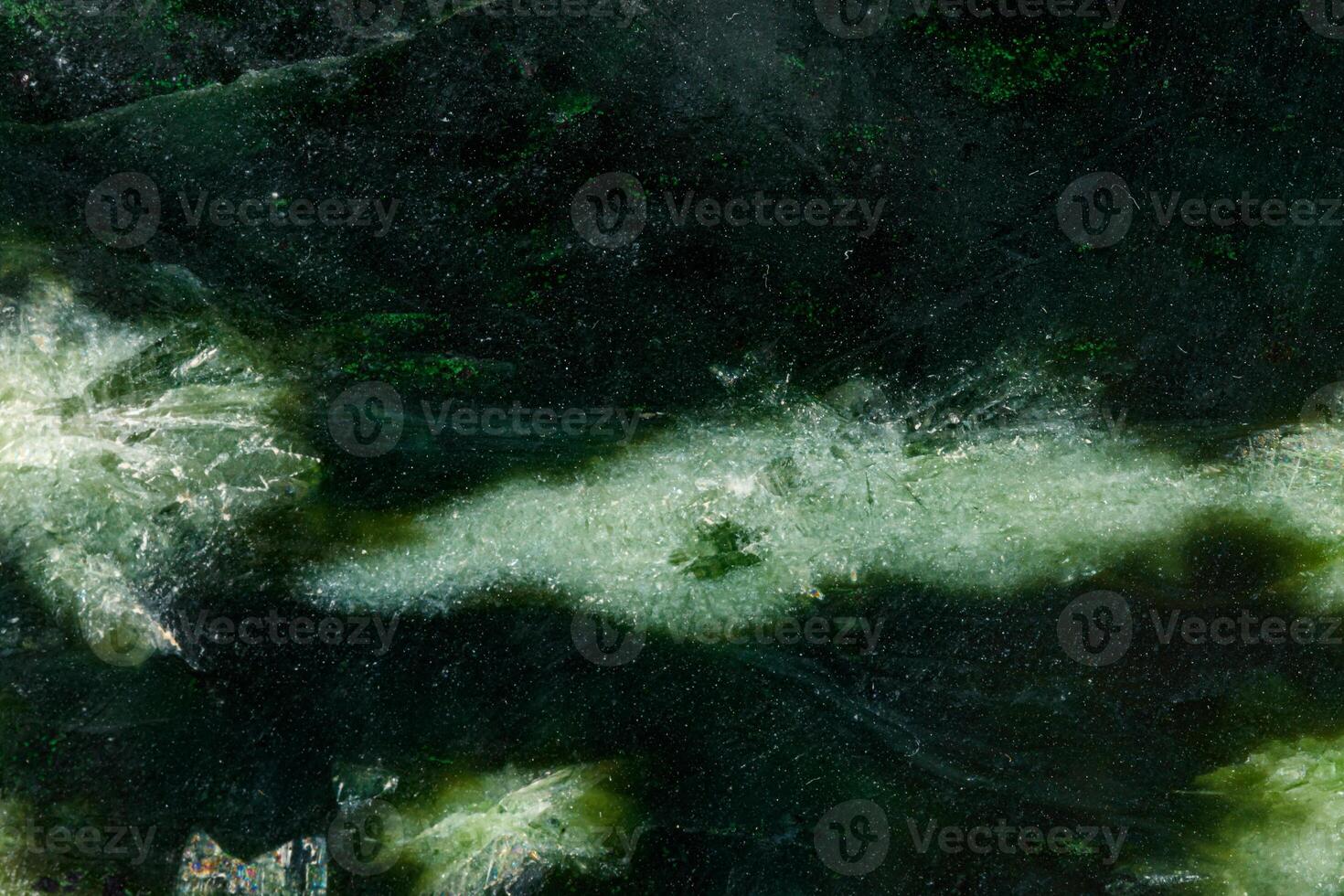 Macro stone Nephrite mineral on white background photo