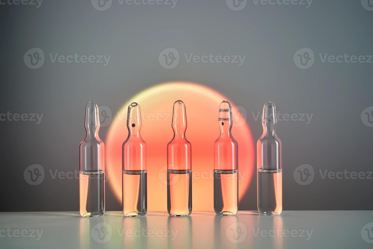 Ampoules for injection against the background of a bright orange circle. photo