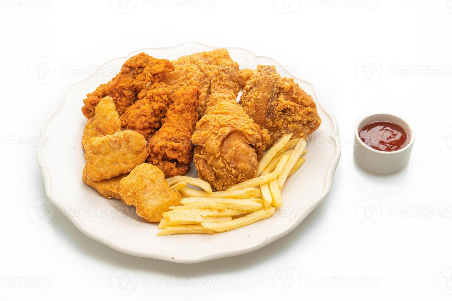 fried chicken with french fries and nuggets on white backgrpund photo