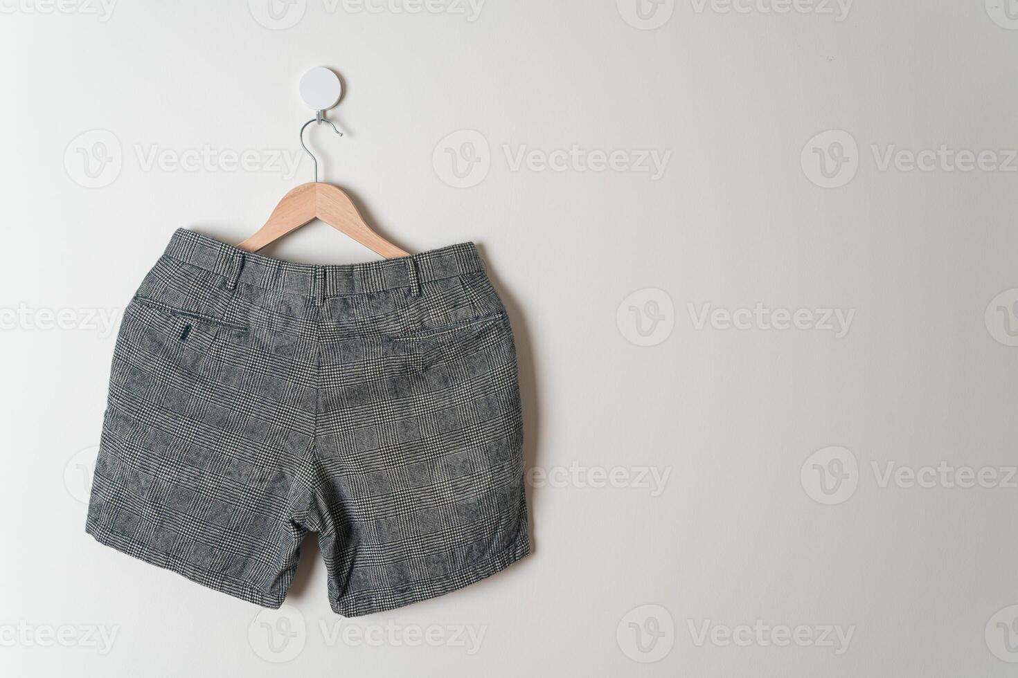short pants hanging on wall photo