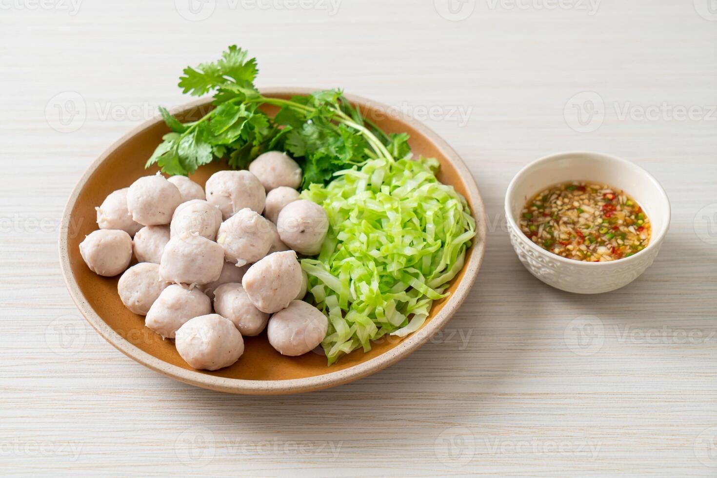 pork meatball with vegetable and spicy sauce photo