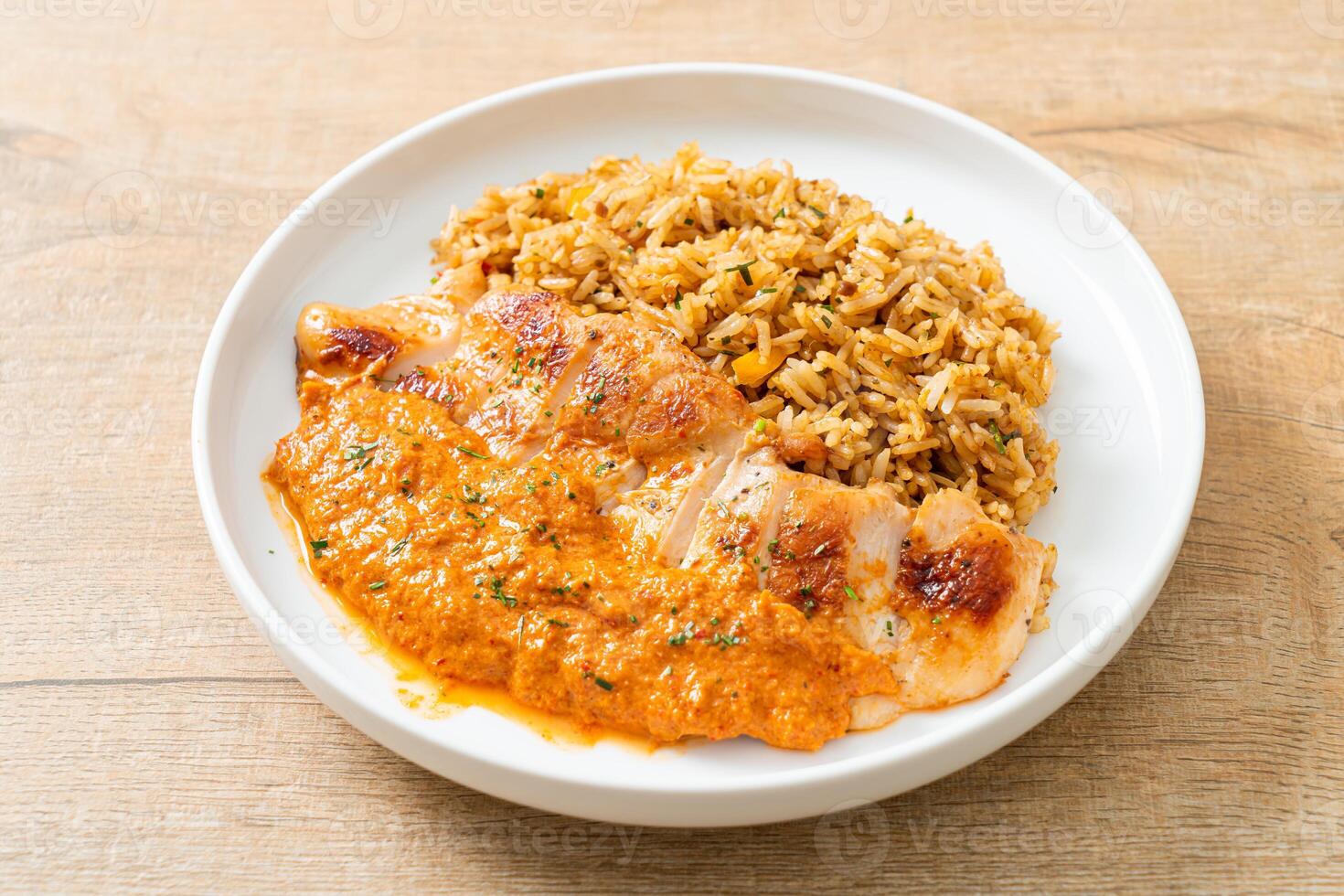 grilled chicken steak with red curry sauce and rice photo