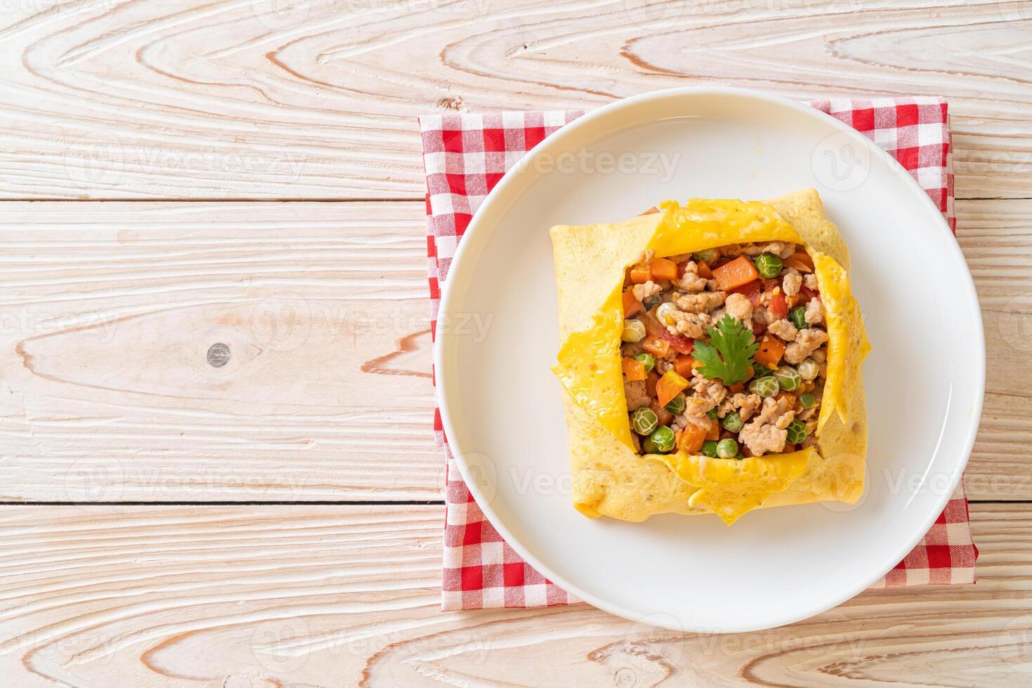 egg wrap or stuffed egg with minced pork and vegetable photo