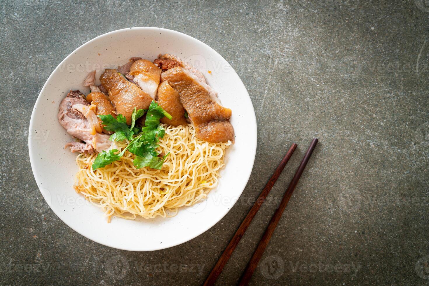 dried stewed pork leg noodles bowl photo