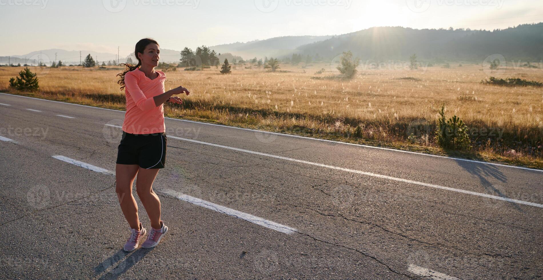 Determined Stretch. Athletic Woman Embraces Post-Run Flexibility in Nature. photo