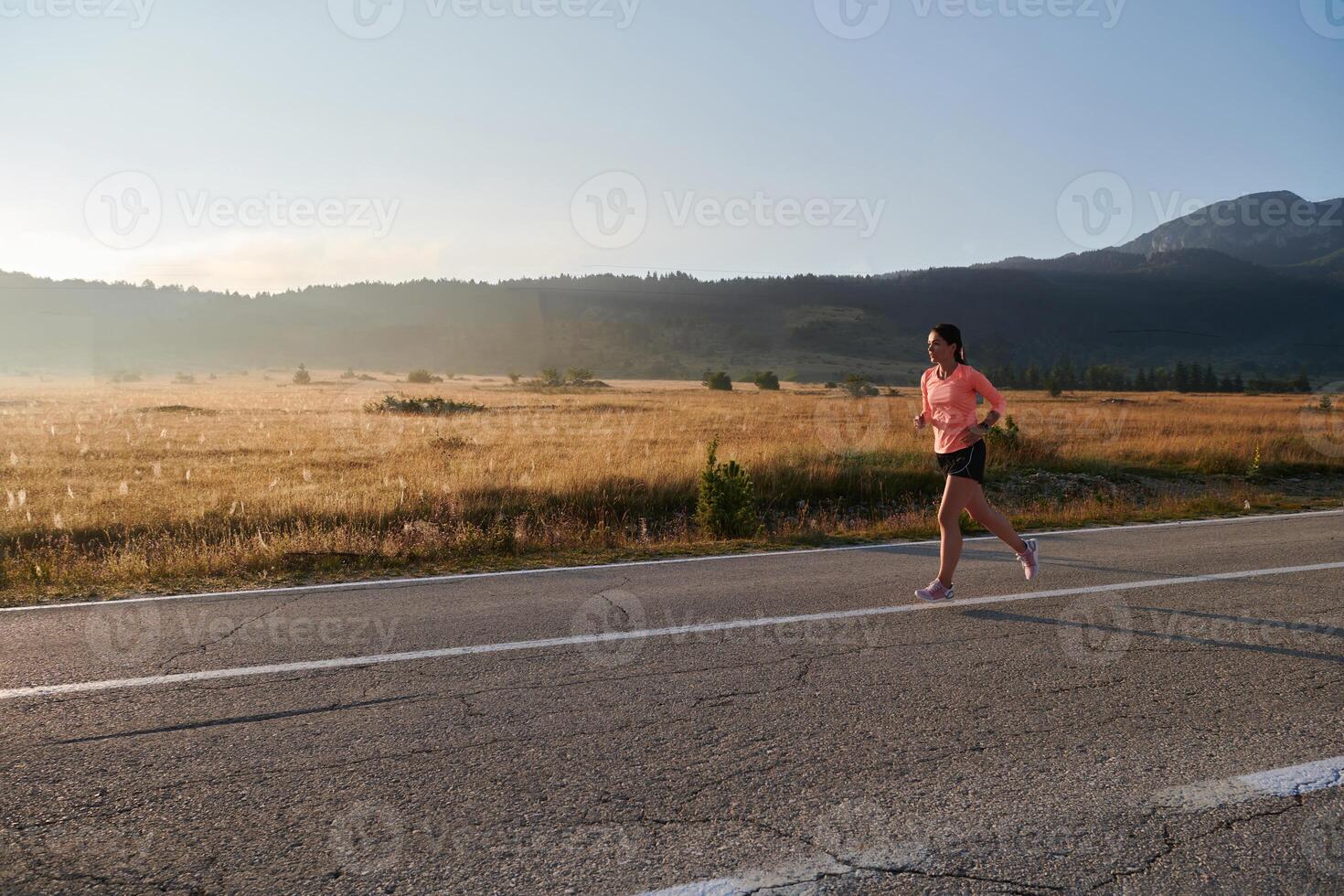 Determined Dawn. Confident and Motivated Athlete Embarks on Sunrise Run. photo