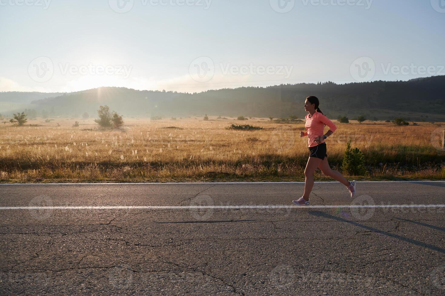 Determined Dawn. Confident and Motivated Athlete Embarks on Sunrise Run. photo