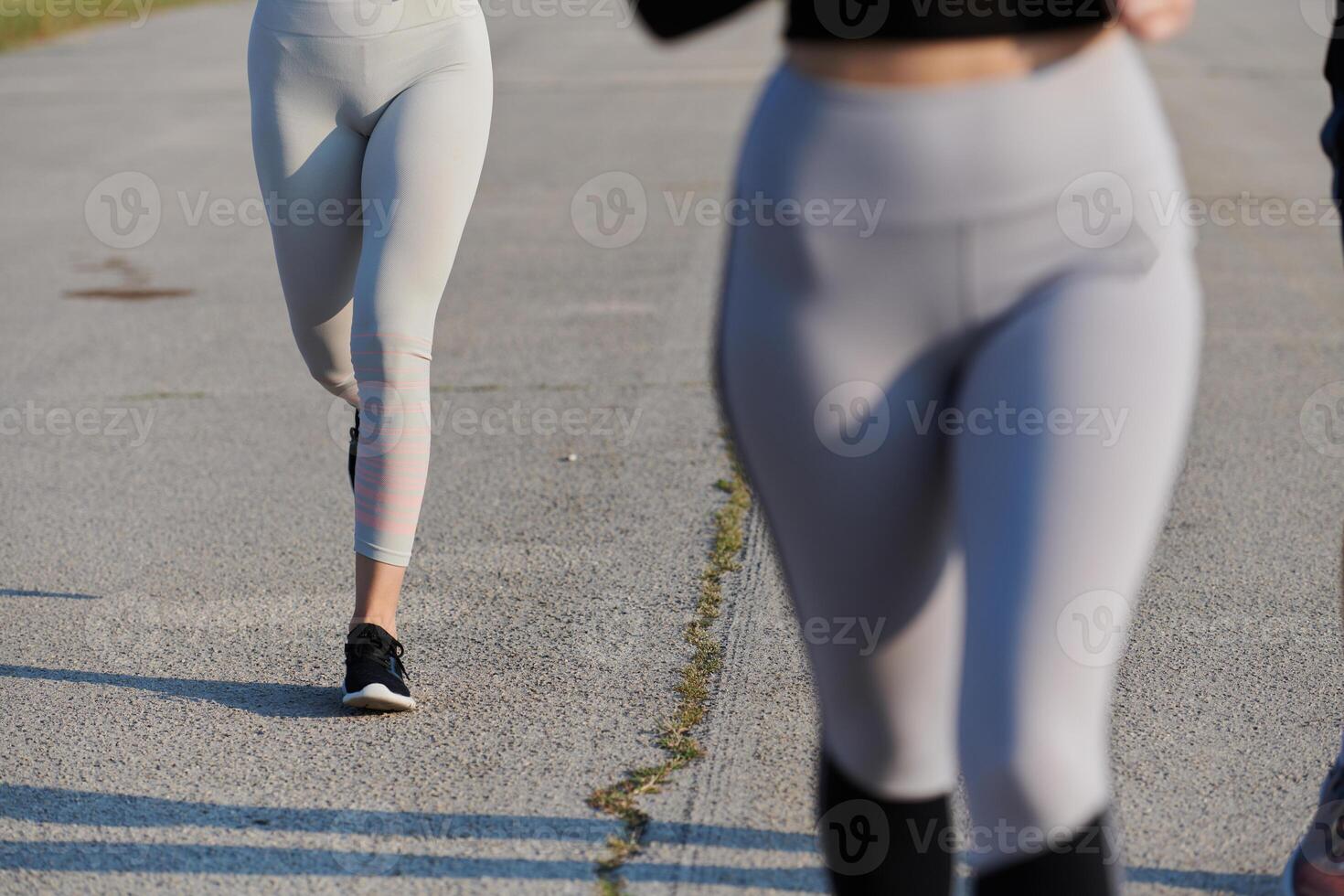 Close-Up. Athletic Runner's Legs Captured in Action on a Sunny Day. photo