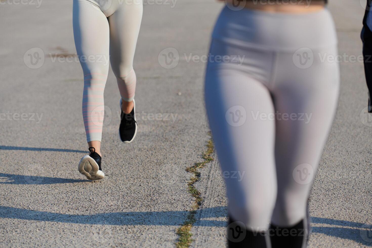 Close-Up. Athletic Runner's Legs Captured in Action on a Sunny Day. photo