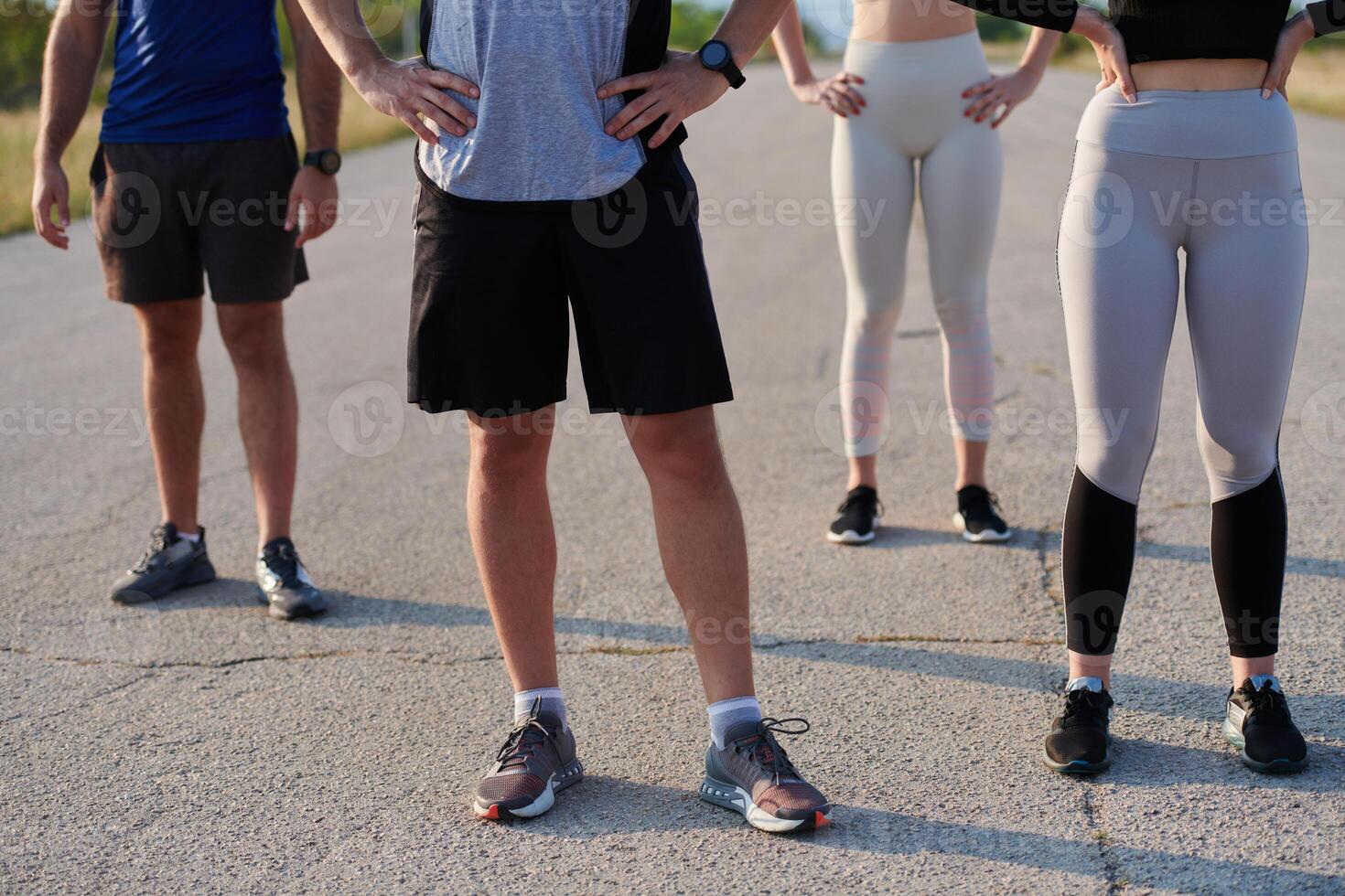 Diverse Athletic Warm-Up. Group Prepares for Intense Running Challenge. photo