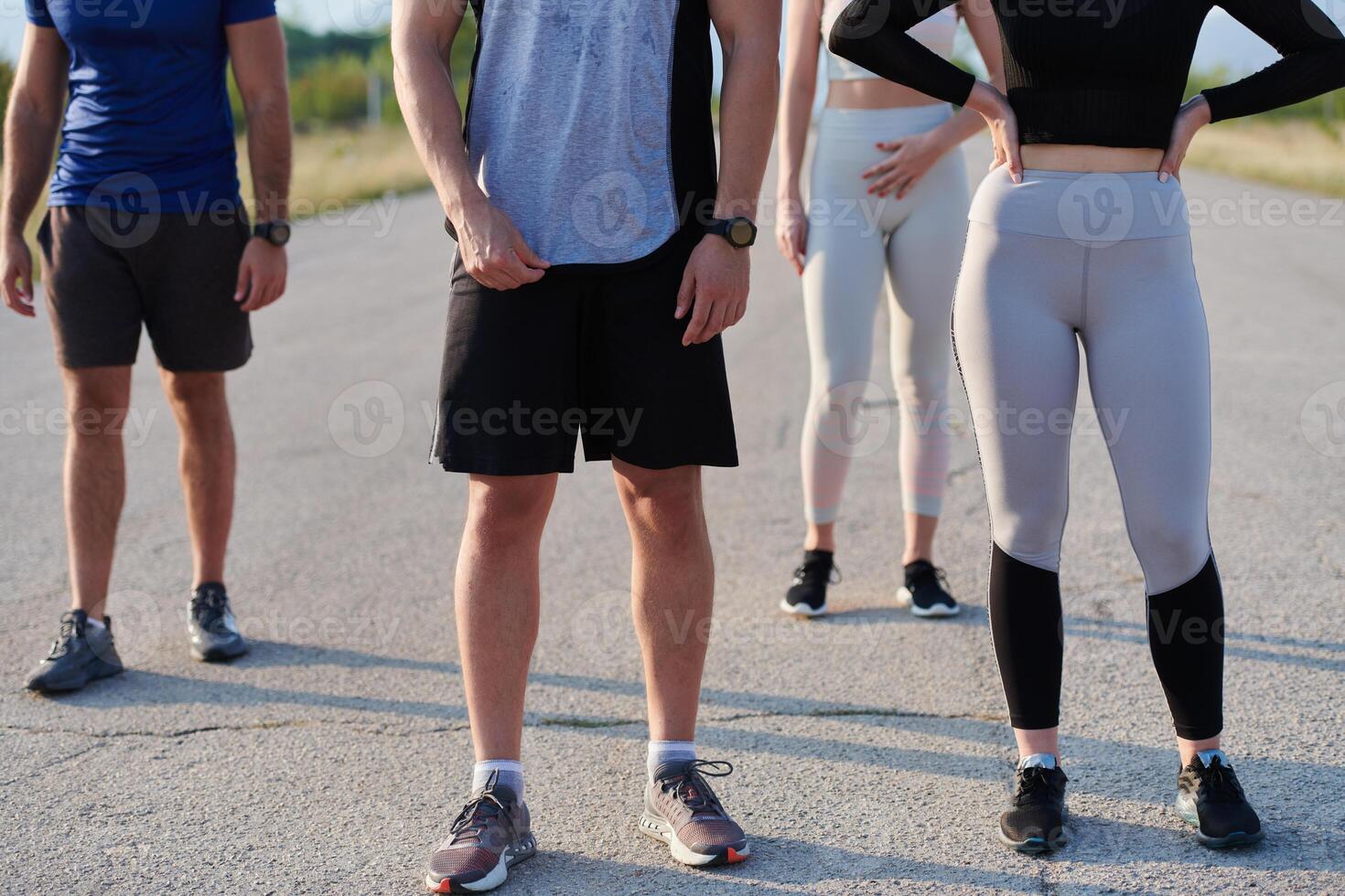 Diverse Athletic Warm-Up. Group Prepares for Intense Running Challenge. photo