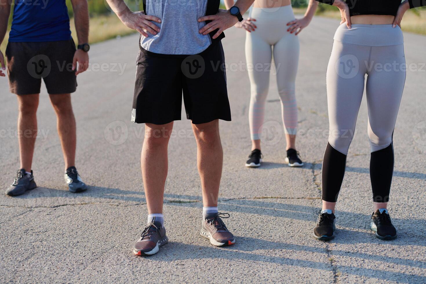 Diverse Athletic Warm-Up. Group Prepares for Intense Running Challenge. photo