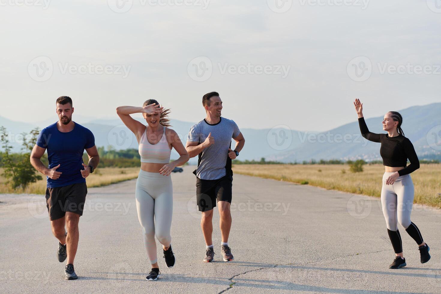 A group of friends maintains a healthy lifestyle by running outdoors on a sunny day, bonding over fitness and enjoying the energizing effects of exercise and nature photo