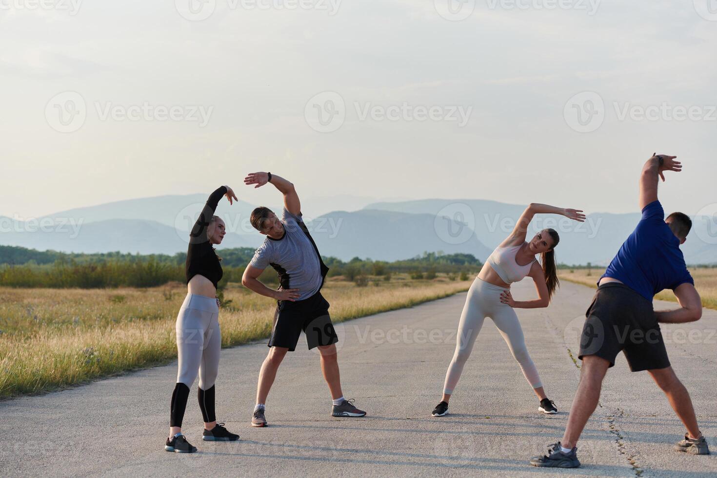 Diverse Group of Athletes Prepare Together for a Run photo