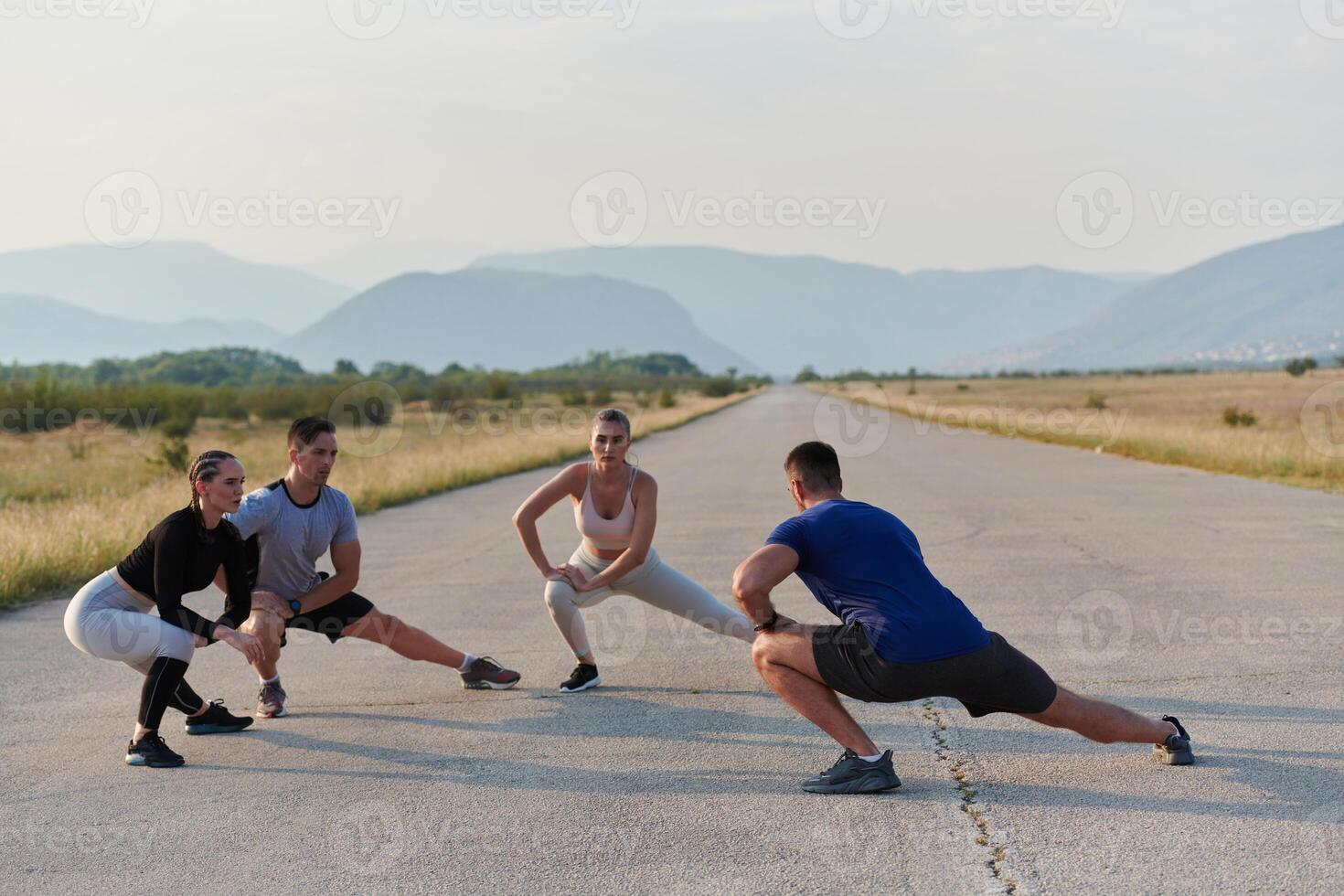 Diverse Group of Athletes Prepare Together for a Run photo