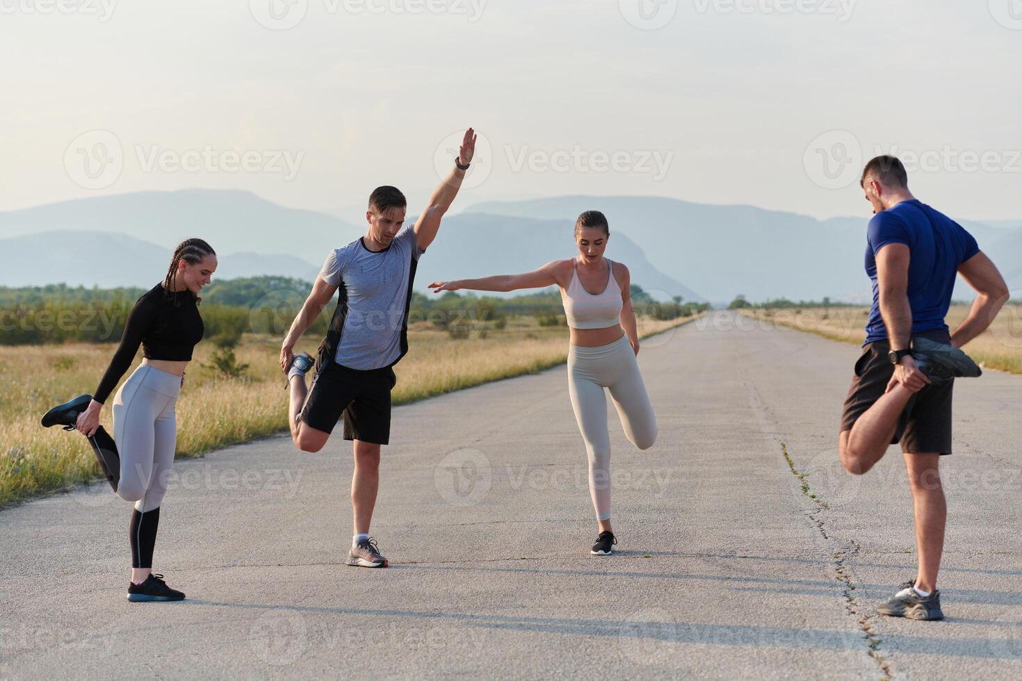 Diverse Group of Athletes Prepare Together for a Run photo
