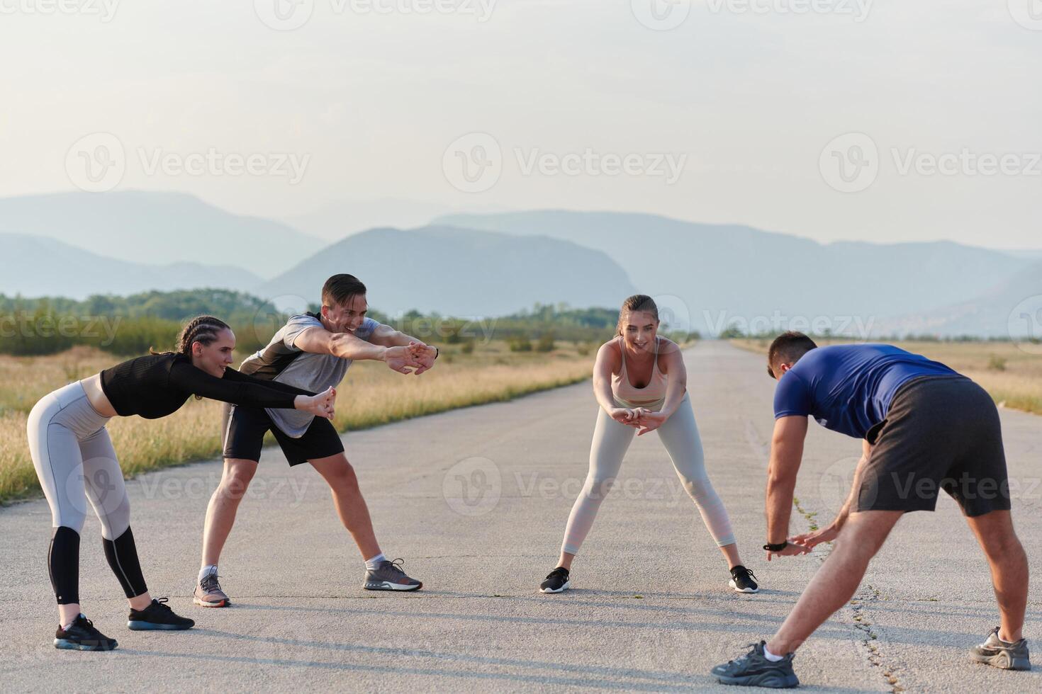 Diverse Group of Athletes Prepare Together for a Run photo