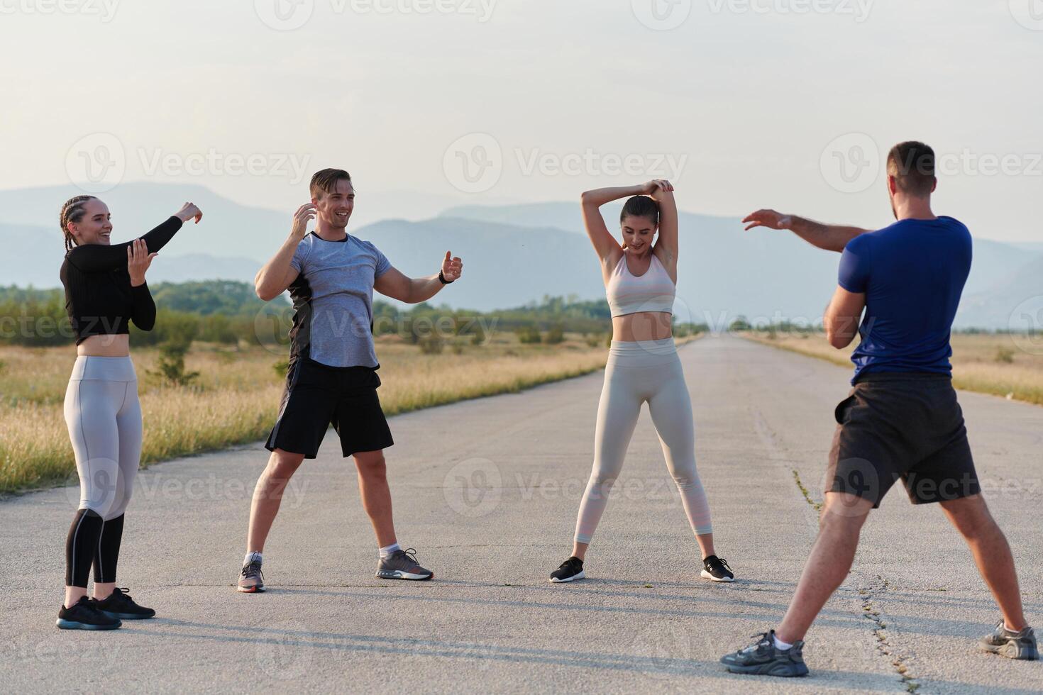 Diverse Group of Athletes Prepare Together for a Run photo
