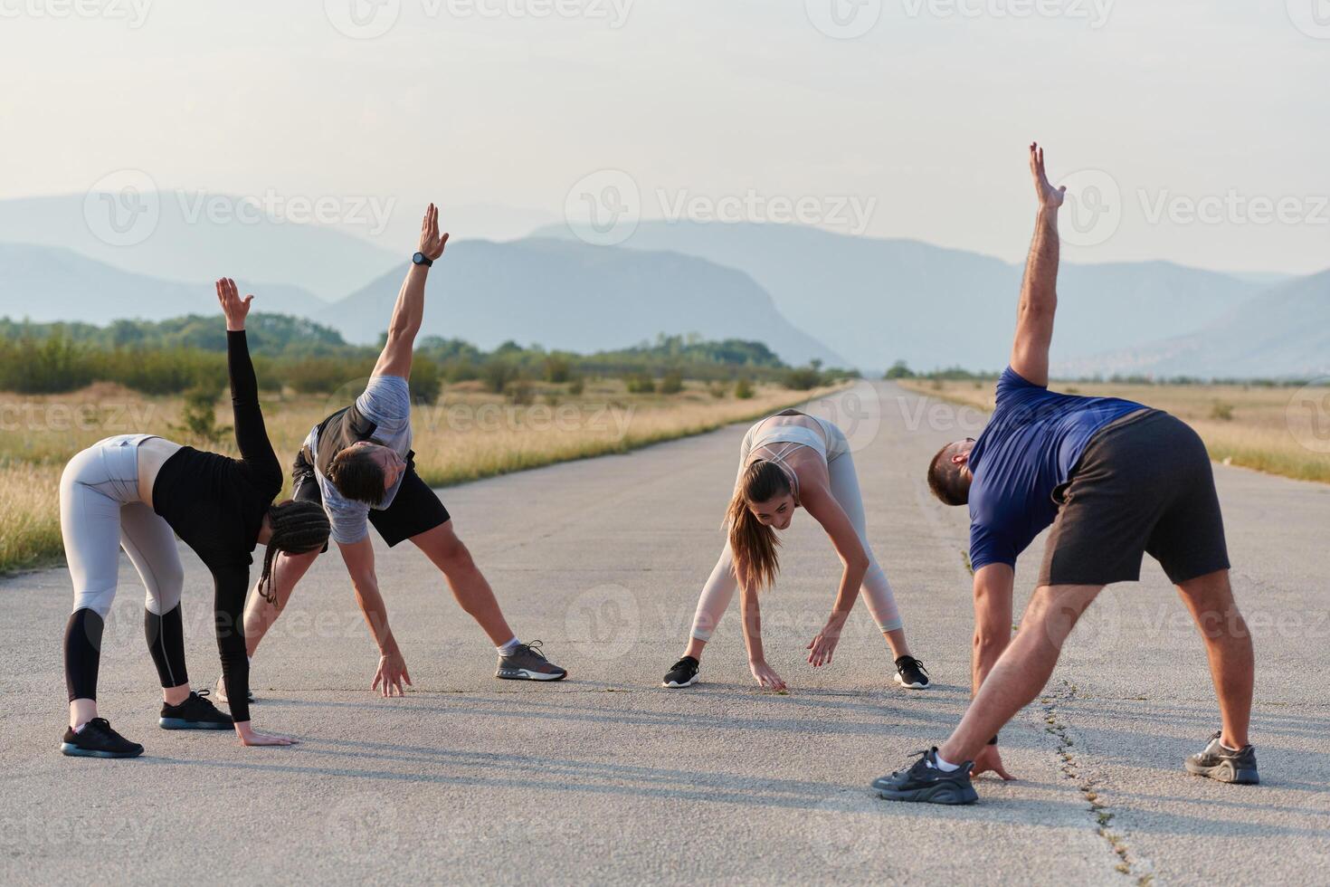 Diverse Group of Athletes Prepare Together for a Run photo