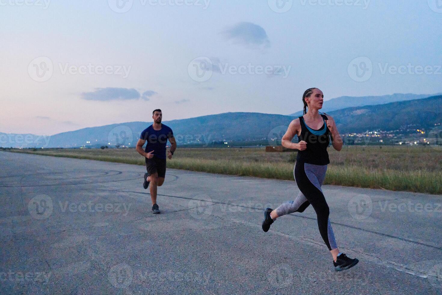 A group of friends maintains a healthy lifestyle by running outdoors on a sunny day, bonding over fitness and enjoying the energizing effects of exercise and nature photo