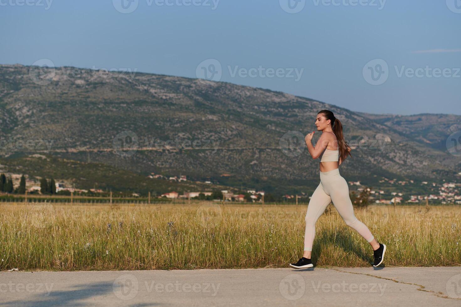 Solo Stride. Determined Athlete Woman Embarks on Fitness Journey for Marathon Preparation. photo
