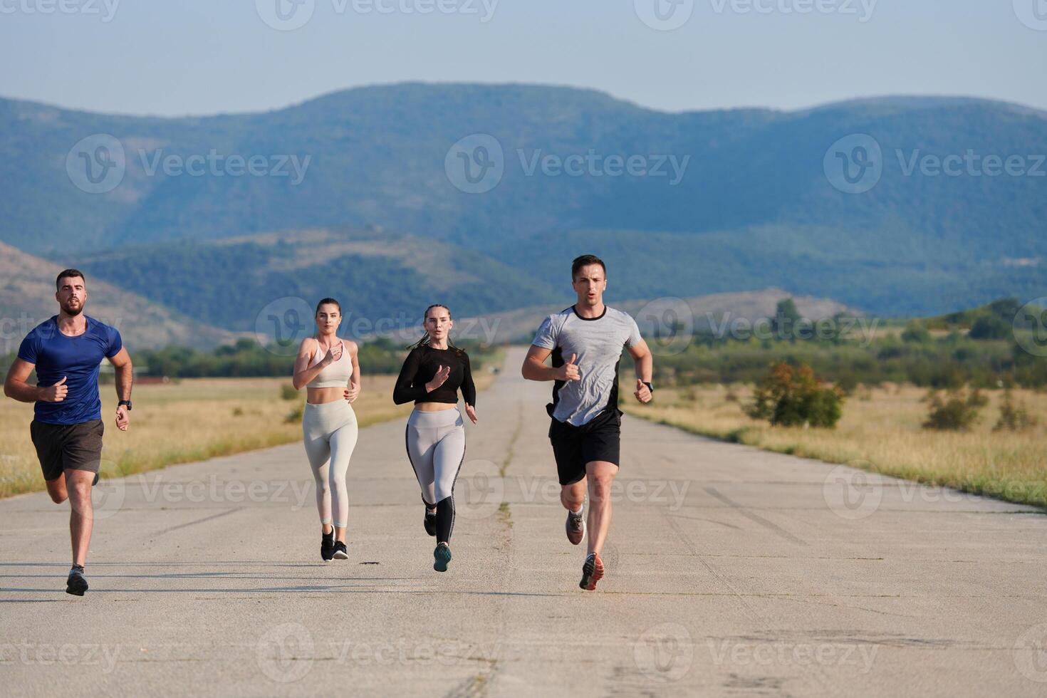 A group of friends maintains a healthy lifestyle by running outdoors on a sunny day, bonding over fitness and enjoying the energizing effects of exercise and nature photo