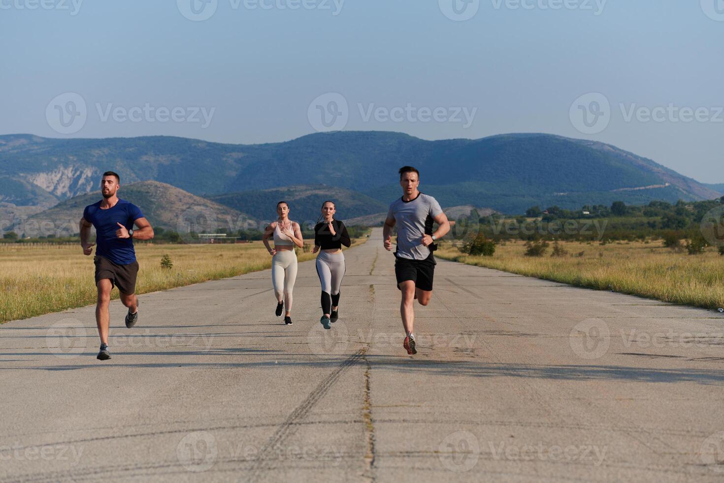 A group of friends maintains a healthy lifestyle by running outdoors on a sunny day, bonding over fitness and enjoying the energizing effects of exercise and nature photo