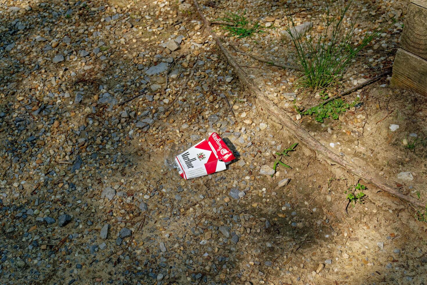 Crossville, Tennessee USA - May 26, 2023 Empty pack of Marlboro cigarette box on the ground photo