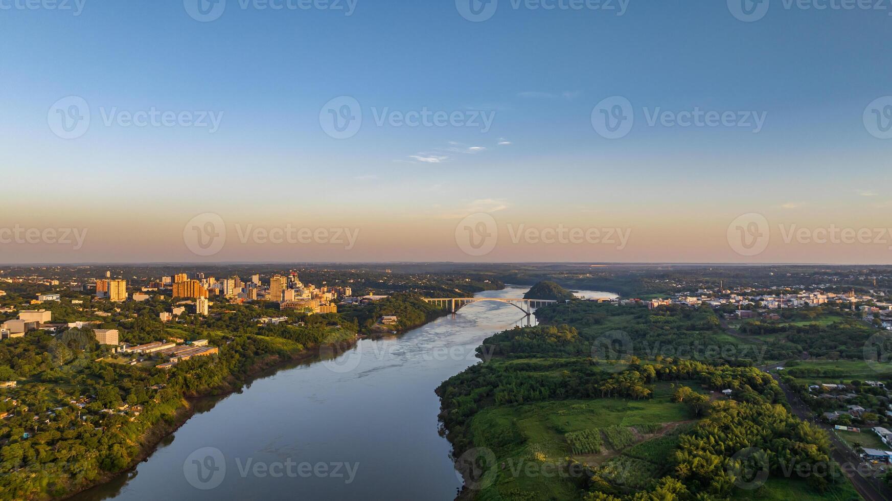 Border between Brazil and Paraguay and connects Foz do Iguacu to Ciudad del Este. Ponte da Amizade in Foz do Iguacu. Aerial view of the Friendship Bridge with Parana river. photo