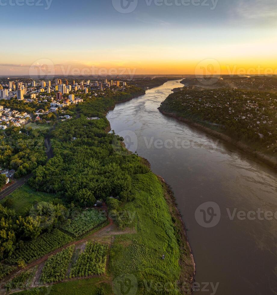 Border between Brazil and Paraguay and connects Foz do Iguacu to Ciudad del Este. Ponte da Amizade in Foz do Iguacu. Aerial view of the Friendship Bridge with Parana river. photo