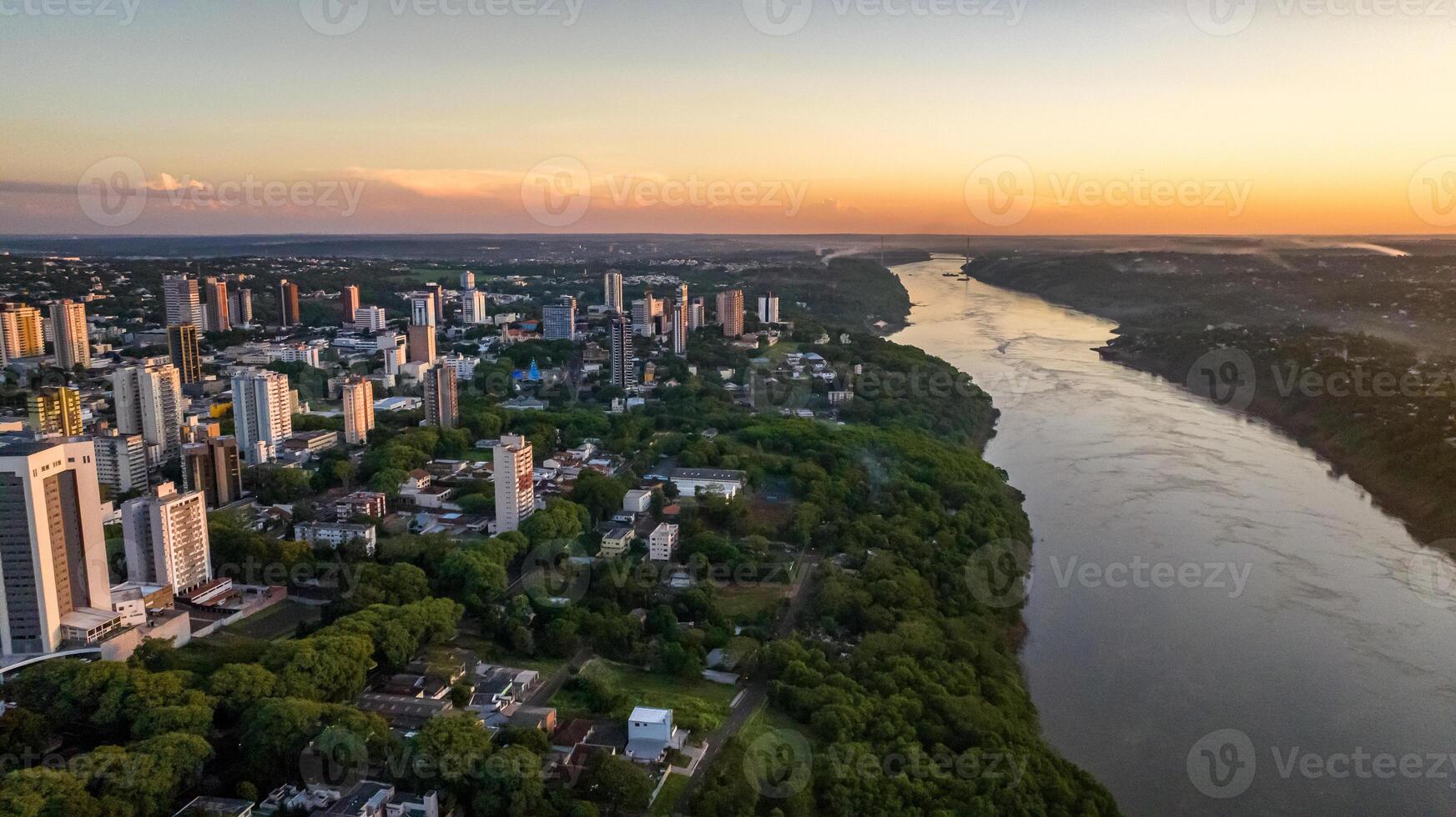 Border between Brazil and Paraguay and connects Foz do Iguacu to Ciudad del Este. Ponte da Amizade in Foz do Iguacu. Aerial view of the Friendship Bridge with Parana river. photo