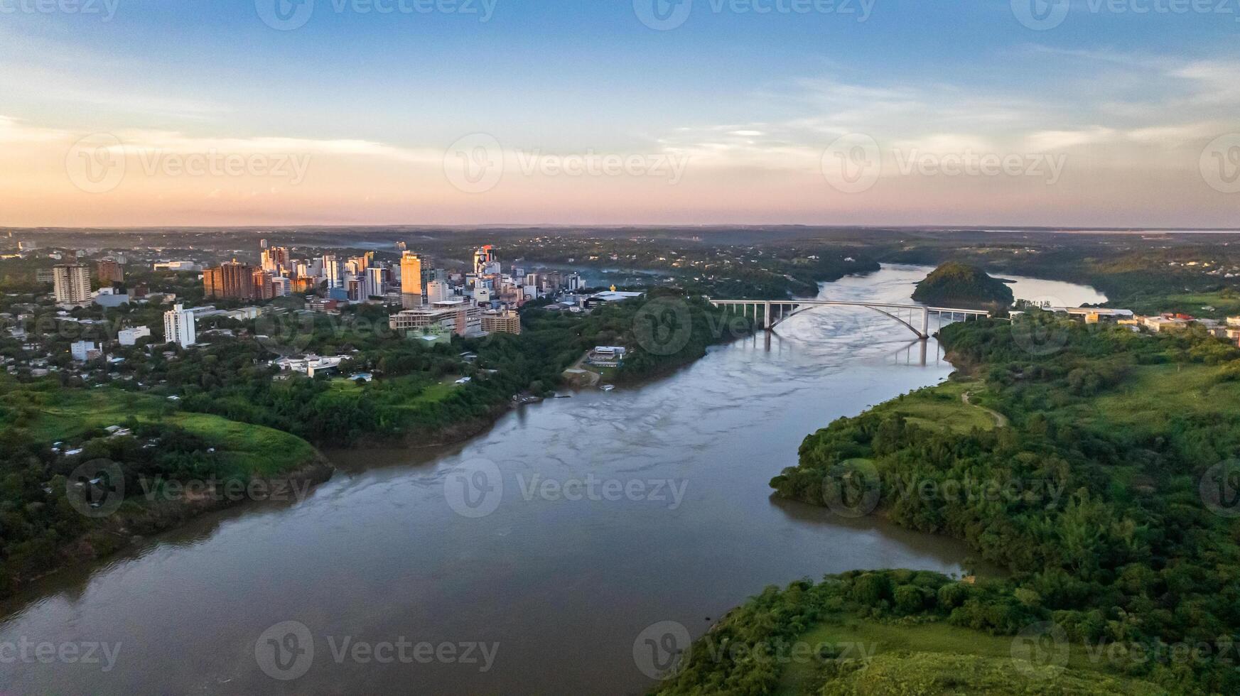 Border between Brazil and Paraguay and connects Foz do Iguacu to Ciudad del Este. Ponte da Amizade in Foz do Iguacu. Aerial view of the Friendship Bridge with Parana river. photo