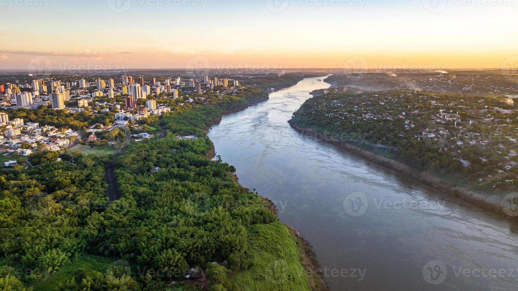 Border between Brazil and Paraguay and connects Foz do Iguacu to Ciudad del Este. Ponte da Amizade in Foz do Iguacu. Aerial view of the Friendship Bridge with Parana river. photo