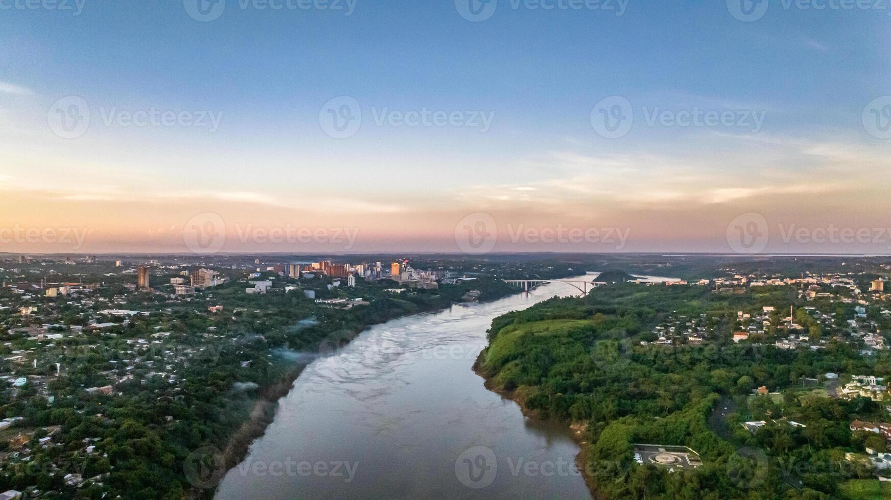 Border between Brazil and Paraguay and connects Foz do Iguacu to Ciudad del Este. Ponte da Amizade in Foz do Iguacu. Aerial view of the Friendship Bridge with Parana river. photo