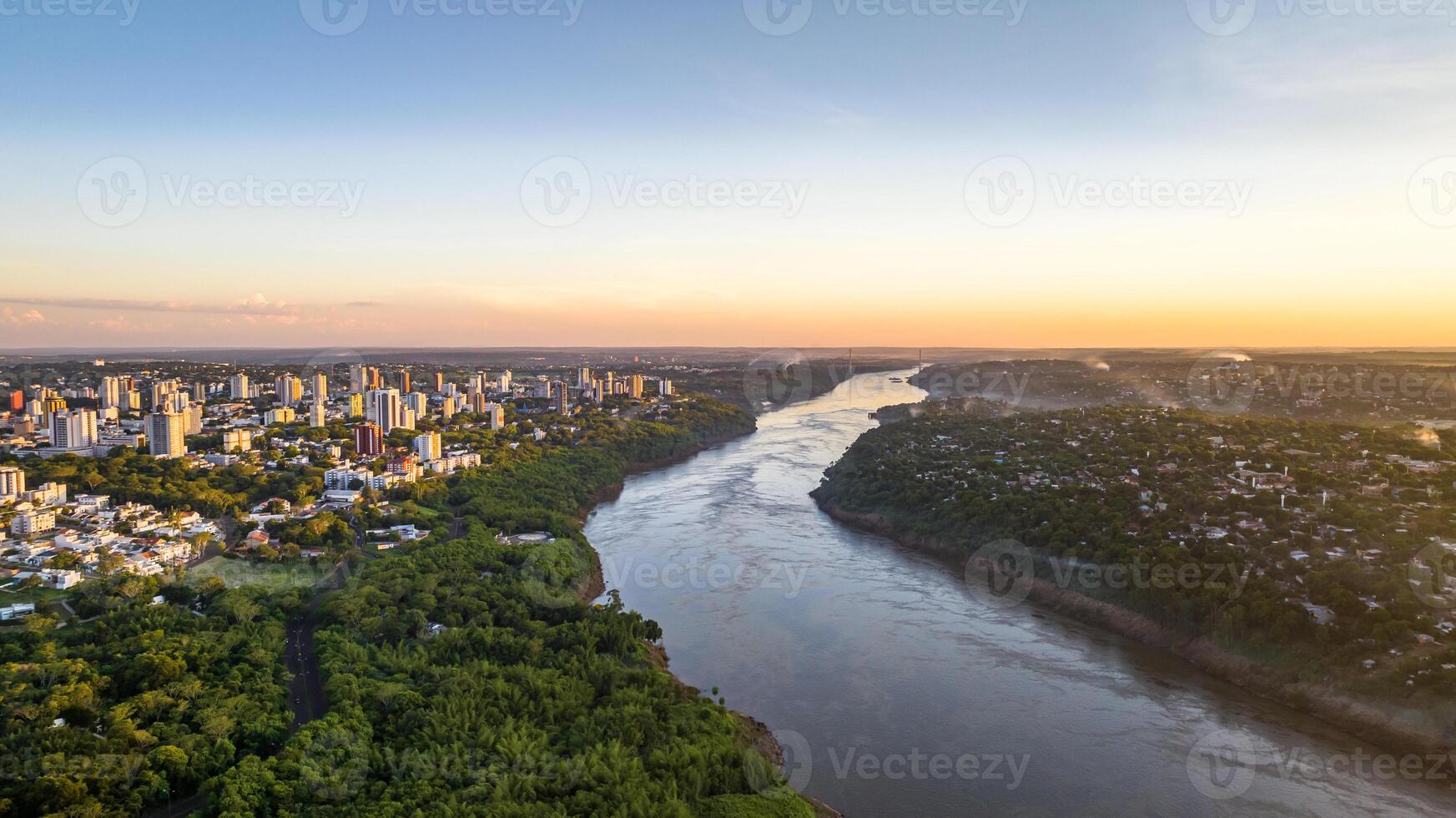 Border between Brazil and Paraguay and connects Foz do Iguacu to Ciudad del Este. Ponte da Amizade in Foz do Iguacu. Aerial view of the Friendship Bridge with Parana river. photo