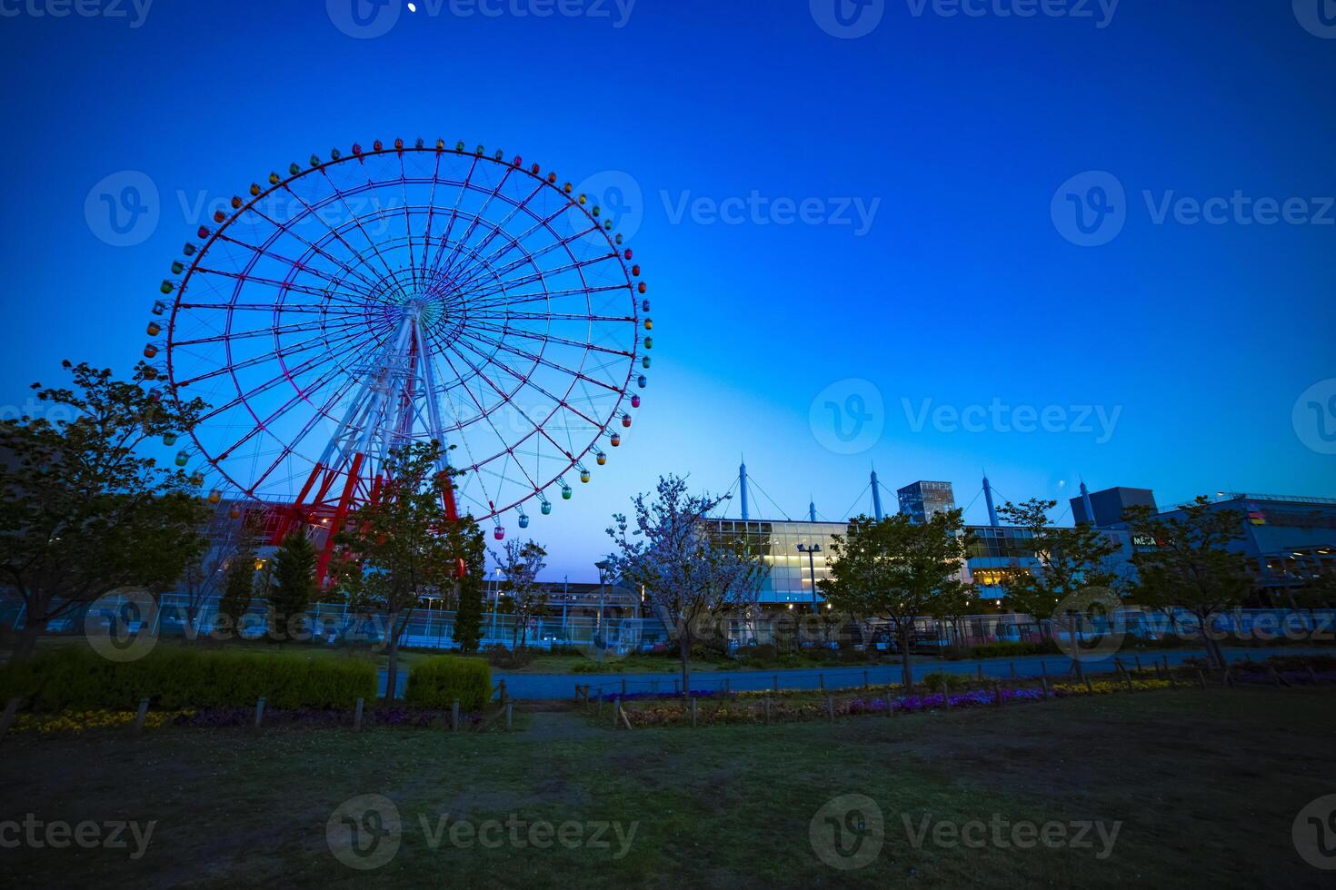 A dusk ferris wheel at the amusement park in Odaiba Tokyo photo