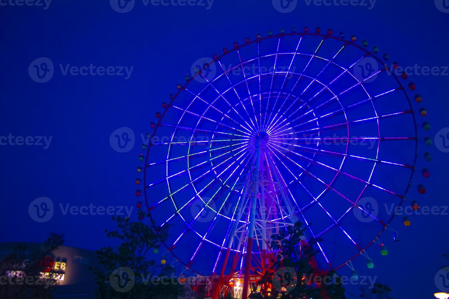 A dusk ferris wheel at the amusement park in Odaiba Tokyo photo