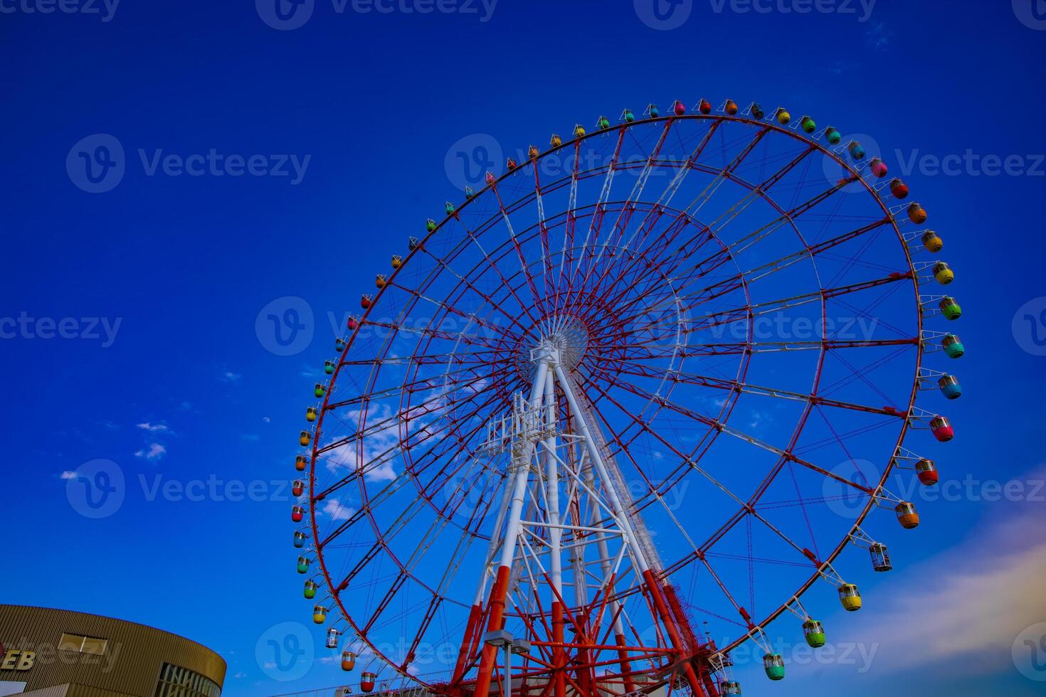 A ferris wheel at the amusement park in Odaiba Tokyo daytime photo