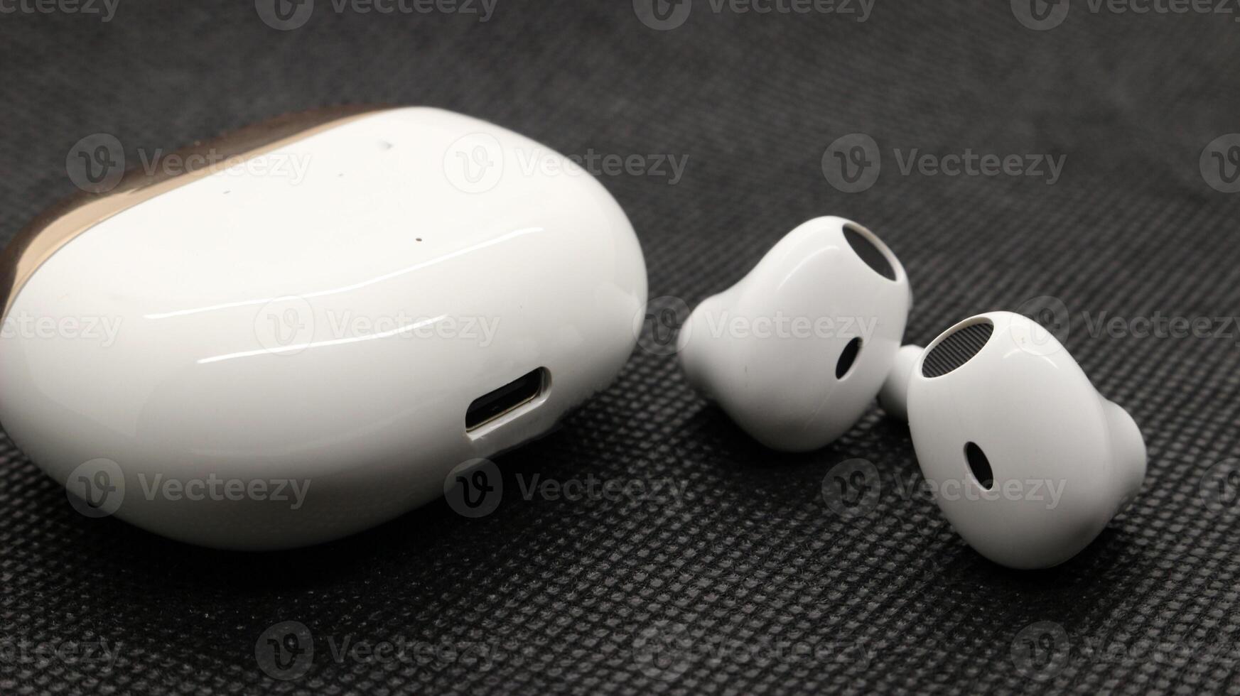 Close up of white TWS true wireless stereo isolated photo