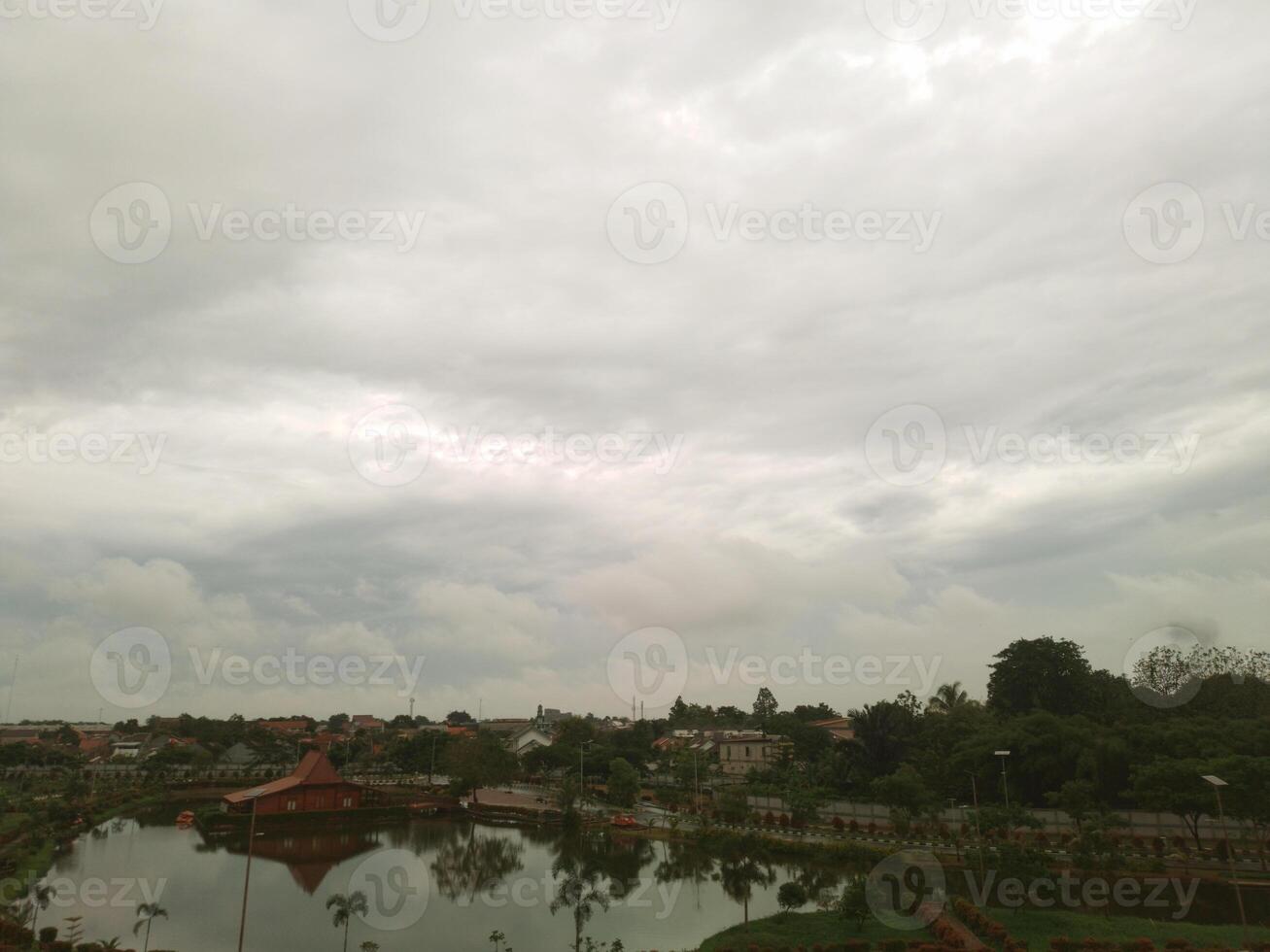 View of the sky with bright clouds on the lake photo