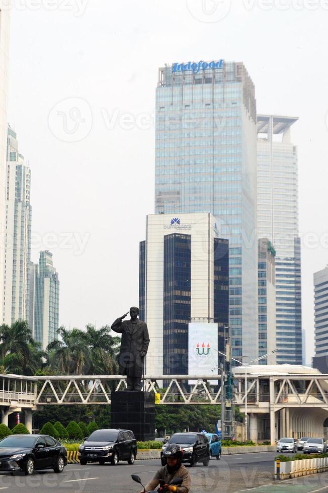 View of the city of Jakarta from a height, General Sudirman statue photo